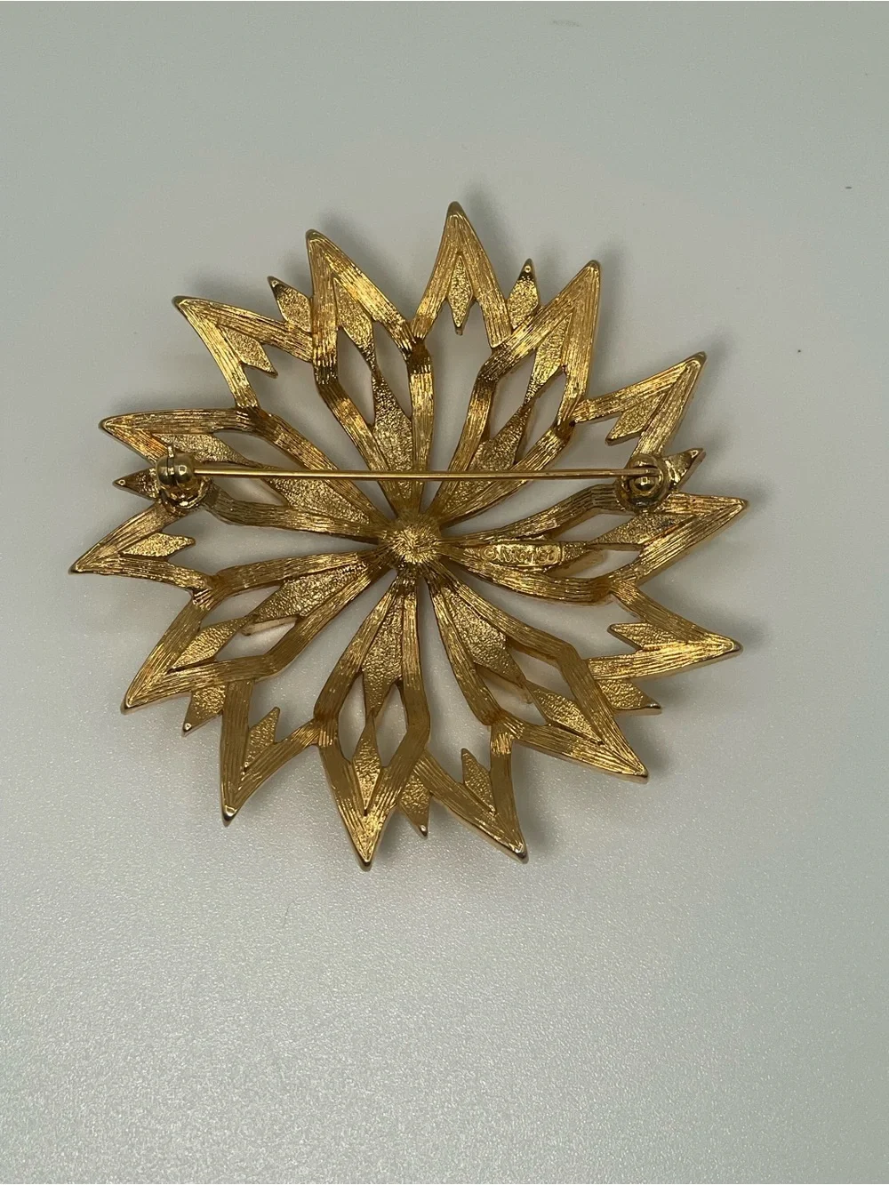 VTG Monet Gold Tone Starburst Floral Textured Brooch
